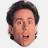 A pixelated cartoon-style image of a person's face with text in black block letters on white background, part of an animated contact sheet frame showing sequential frames.
