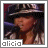 Alicia Keys in a black and white striped hat singing into a microphone with four distinct facial expressions across frames.