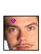 Two side-by-side pixelated images of a person's face with a small pink heart symbol on the forehead, one image slightly brighter than the other.