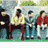 Static 48x48 pixel icon showing four figures in a row against a blurred background with green and blue tones, likely from a movie scene.