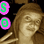 Pixelated image of a woman with long brown hair wearing a gold top, two pink circular icons on left side, and yellow text reading 'GANGSTA' above her head.