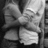 Black-and-white photo of two people embracing, with pink text reading 'Guess who's single? ... me!!' on a black background.