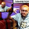 repeated images showing a person with light brown hair and glasses holding a red cello against a purple striped background, with 'NAHMASTER' text above each