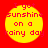 Four identical yellow circular icons with red text on a solid red background, each displaying the phrase "I got sunshine on a rainy day" in pixelated font.