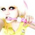 Pixelated static image of a person with light brown hair, dark eyes, and a yellow top with pink accents, holding a pink object near their face.