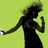 Pixelated figure in black dress with green hair against light green background, arm extended holding white object.