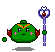 Green pixelated character with red side fins, pink cheek marks, and orange headband holding a purple staff with heart-shaped top.