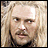 A pixelated image of a person with long blonde hair and mustache, next to text reading "THE LORD OF THE RINGS THE TWO TOWERS" and "DECEMBER 18" on black background.
