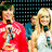 Four people in red and white clothing stand together against a dark background with blue accents