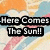 Pixelated image with bold text 'Here Comes The Sun!!' over a colorful abstract background of orange, blue, and pink hues.