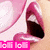 A close-up of a person's mouth with pink lips and teeth, showing text overlays in bright pink boxes.