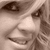 A sepia-toned close-up of a person's face with red text overlays in the top-right corner, showing subtle facial expression changes across frames.