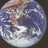 Pixelated Earth image on left, blue background with pixelated text 'Truly Out of This World' on right.