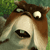 Pixelated close-up of a dog's face with wide eyes and an open mouth, set against a blurred green background.