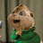 Pixelated character with brown hair and green shirt against gray background, next to blue with cyan text