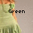 A pixelated image of a person in a green dress with fringed hem, overlaid with text fragments.