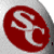 Red circular icon with white stylized letter 'S' on gray background, pixelated rendering.