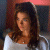 A pixelated image of a person with long brown hair wearing a white top, next to green text reading 'Original Icons .com' on a dark background.