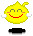 Yellow pixelated smiley face with closed eyes, red mouth, pink cheeks, white ear-like shapes, and a small yellow curl on top, set against a gray background.