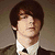 A split- image shows a person in a brown suit with a white shirt and black tie, with orange text reading "Drake Bell" below