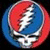 Circular icon with red and blue gradient background featuring a white skull graphic, next to text reading 'Have A Grateful Day!' on black.