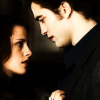 Two people in profile view face each other against a dark background, with warm lighting highlighting their profiles.