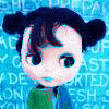 Animated character with dark blue pigtails and brown hair strands, wearing green clothing against a blue background with faint text.