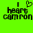 Green background with black pixelated text reading "I heart cammon" in two versions, one with a heart symbol replacing the word 'love' and another without.