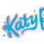Blue and pink stylized text 'Katy by Perry' above a pixelated image of a woman with dark hair, hand on head, next to 'Debut Album' and 'One of The Boys' text.