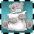 Gray teddy bear with blue eyes sits on white base holding open book, set against teal background.