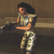 A pixelated figure in military-style clothing holds a large weapon, shifting stance