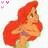 Animated icon of a red-haired character with green eyes, wearing a purple top and light green bottom, in profile view against white background.