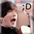 A person with dark hair and a green collar shirt appears in four , mouth open wide as if shouting or laughing, with the text ;D visible on the right side of each