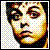 A contact sheet of seven animated frames showing a pixelated face and text-based animation with
