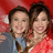 Two people pose together against a red background with green text reading 'its like me and emily m' on a blue