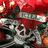 A pixelated holiday-themed icon with a red background, green accents, and silver text reading "MERRY CHRISTMAS" in the center.