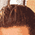 A 2x2 contact sheet of a pixelated animated icon featuring two individuals in an orange shirt, with visible facial features and partial text on the shirt.