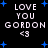 Black background with white pixelated text reading "LOVE YOU GORDON <3" and scattered blue star shapes.