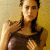 A pixelated image of a person with long dark hair wearing a sleeveless top, positioned next to green text reading 'Original Icons .com' on a solid background.