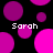 Black background with scattered magenta and pink circles; four instances of the text 'Sarah' in white pixelated font.