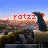 A pixelated image of a character with dark hair and red accents on the head, positioned against a landscape background with blue sky and brown terrain.