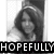 A black-and-white photo of a person with long hair and a headband appears in the top-left, while a colorful pixelated background with hearts and stars is in the bottom-left.