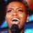 A 48x48 pixel buddy icon split into two sections: a person singing on the left and green text on a dark background on the right.
