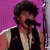 Two side-by-side show a person with curly dark hair; left has purple background, right beige. Below is pink text reading "I Love Nick Jonas!"
