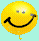 Yellow smiley face balloon with black curved mouth and gray eyes, floating against light blue background with subtle pixelated texture.