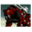 A 4-frame animated contact sheet showing a red and black robotic creature with glowing yellow eyes against a cloudy sky background, displaying subtle pose changes across frames.