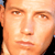 Static pixelated close-up of a person's face with warm skin tones and visible facial features including eyes, nose, mouth, and eyebrows.