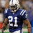 Pixelated image of a football player in blue uniform with white number 91, wearing helmet and holding brown object.