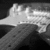 A black-and-white animated icon shows a guitar neck with frets and strings, where the top portion of the image changes brightness across frames.