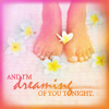 A pair of bare feet with a white and yellow flower between toes, surrounded by floating flowers on a soft pink background with text.